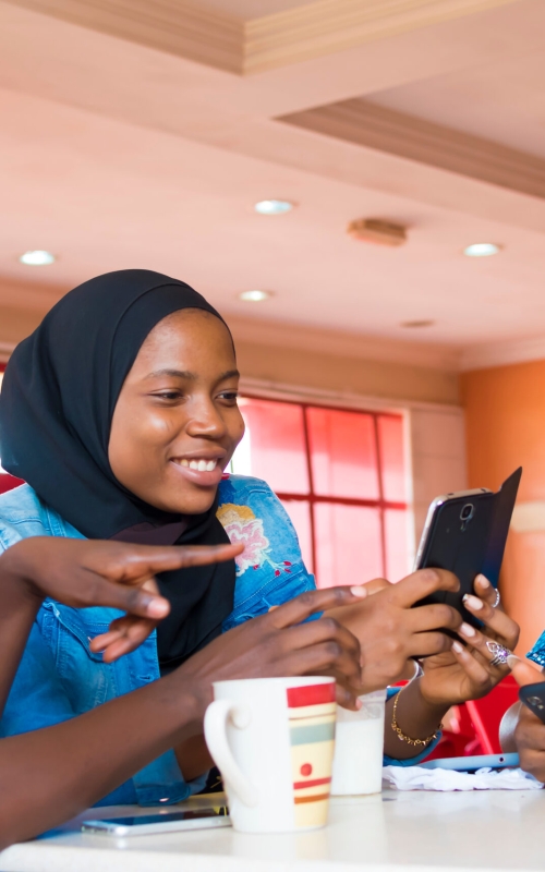 Girl,Friends,Hanging,Out,Together,In,A,Fast,Food,Restaurant