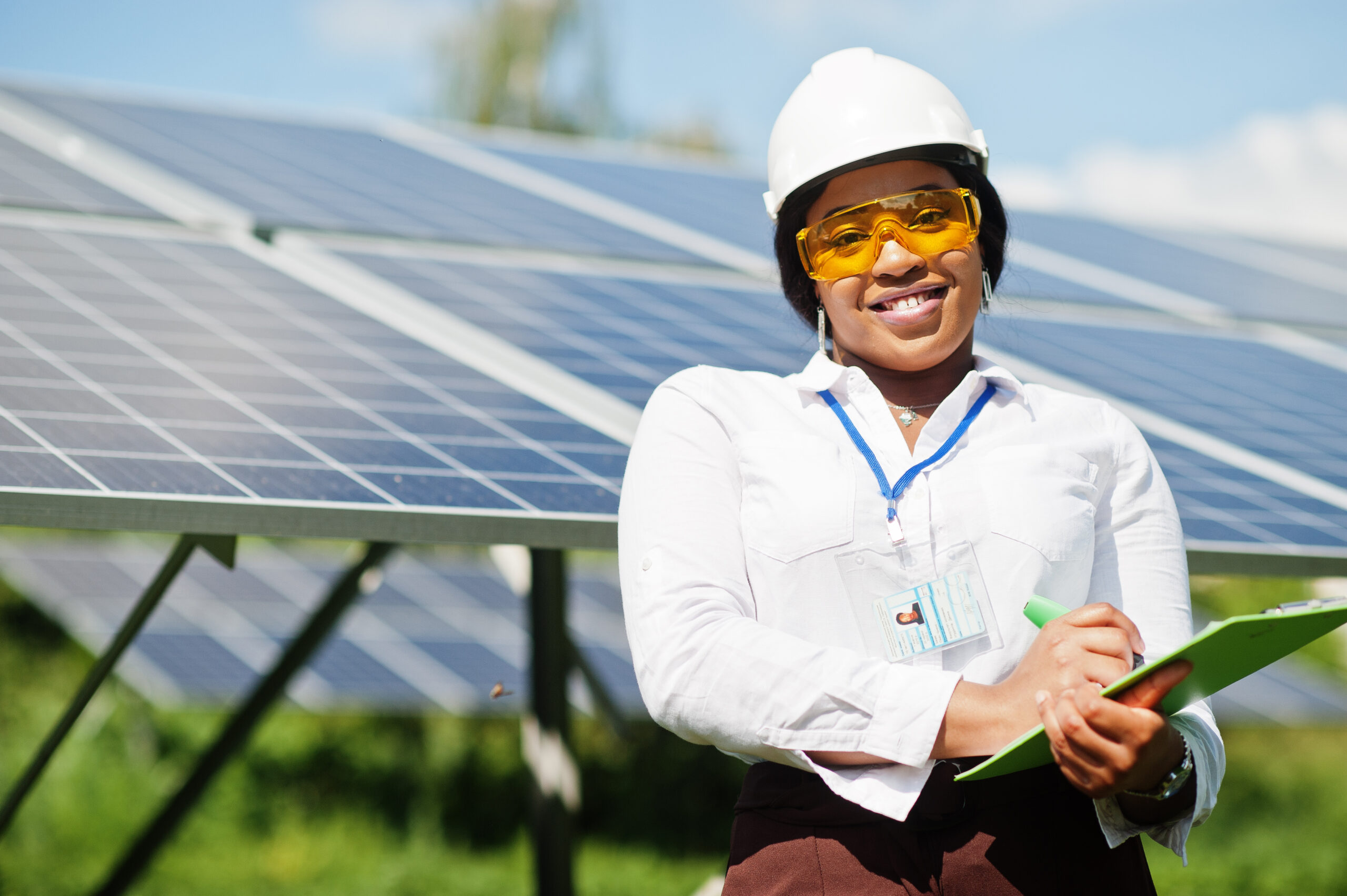 African,American,Technician,Check,The,Maintenance,Of,The,Solar,Panels.